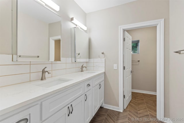 1550 E Apache St N, Tulsa, OK 74106 - full bath featuring double vanity, baseboards, and decorative backsplash