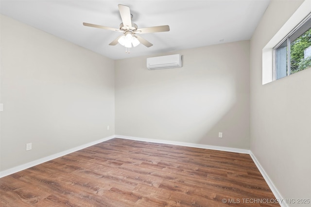 1550 E Apache St N, Tulsa, OK 74106 - empty room with a wall mounted AC, wood finished floors, baseboards, and ceiling fan