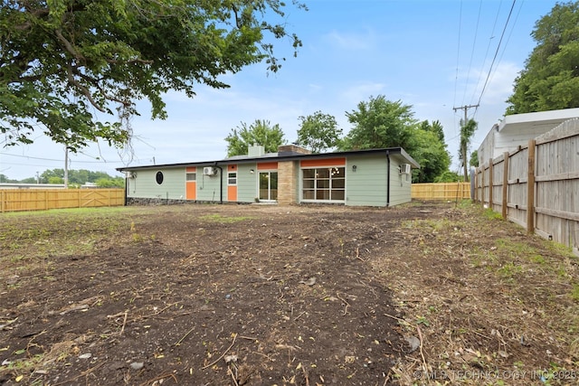1550 E Apache St N, Tulsa, OK 74106 - back of property featuring a fenced backyard
