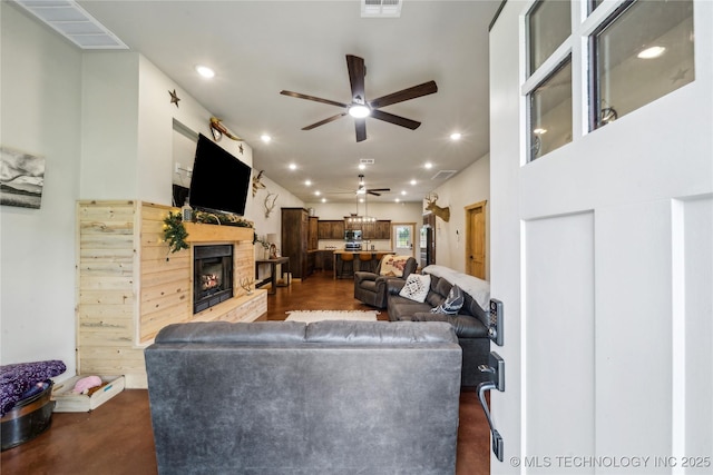 17784 S 210th Rd, Okmulgee, OK 74447 - living room featuring a ceiling fan, recessed lighting, and a lit fireplace