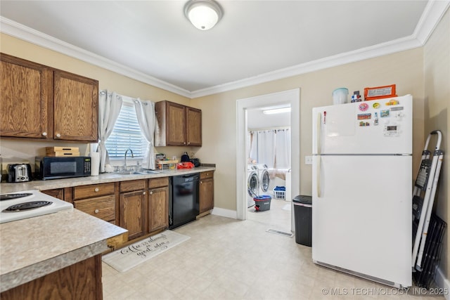 1211 E Fairview Ave, Sapulpa, OK 74066 - kitchen featuring black appliances, a sink, independent washer and dryer, ornamental molding, and brown cabinetry