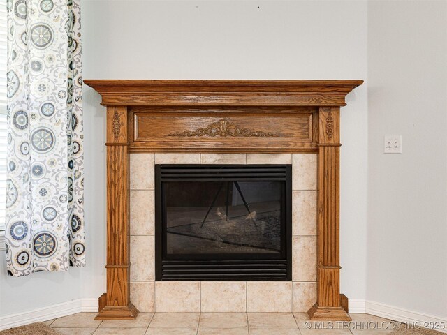 8704 N 140th E Ct, Owasso, OK 74055 - detailed view of baseboards and a tile fireplace