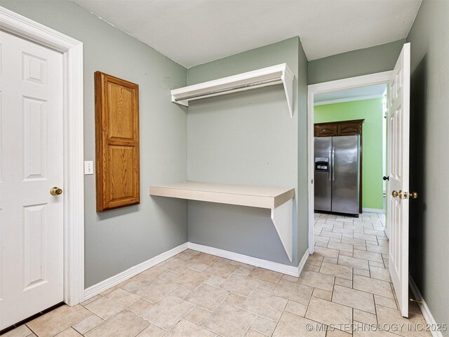 8704 N 140th E Ct, Owasso, OK 74055 - walk in closet featuring stone finish floors