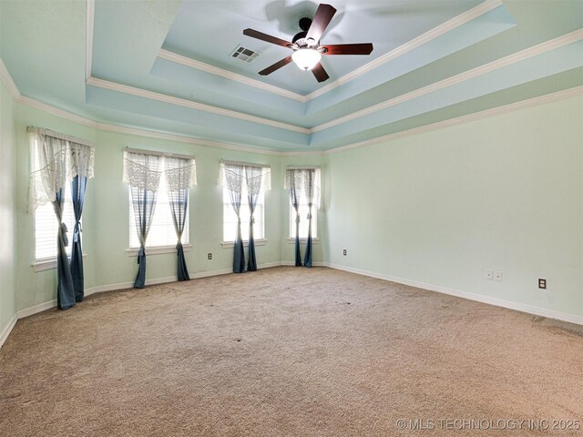 8704 N 140th E Ct, Owasso, OK 74055 - spare room with ceiling fan, a tray ceiling, carpet, and crown molding