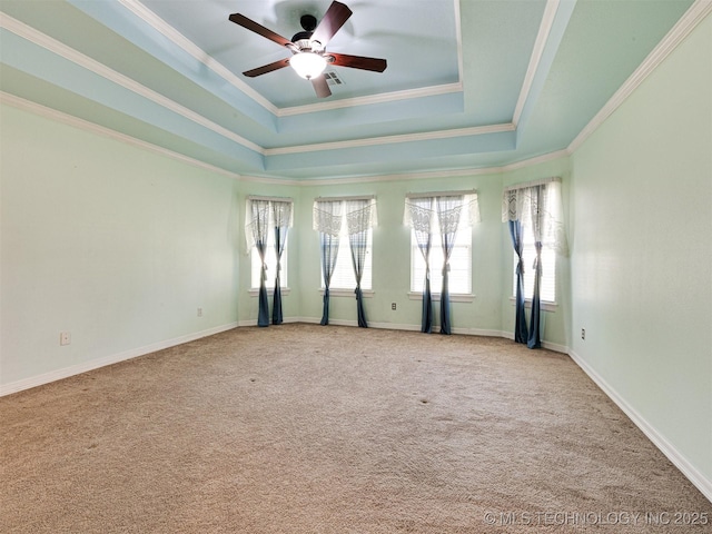 8704 N 140th E Ct, Owasso, OK 74055 - empty room with a raised ceiling, a ceiling fan, carpet flooring, and crown molding