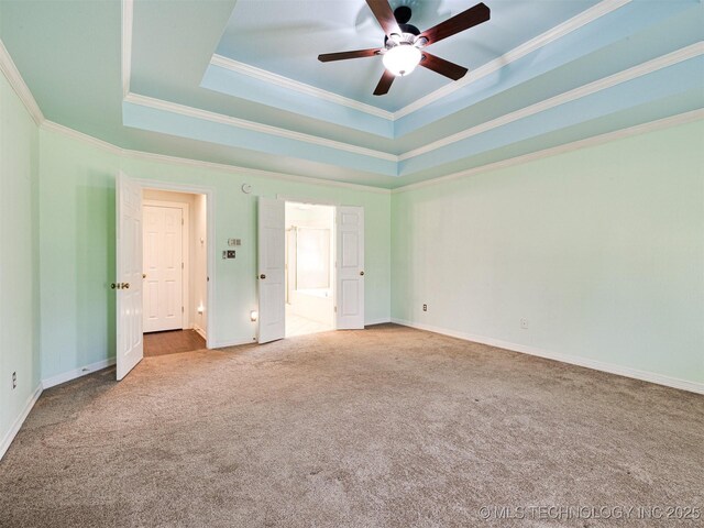 8704 N 140th E Ct, Owasso, OK 74055 - unfurnished bedroom featuring carpet floors, crown molding, a raised ceiling, baseboards, and ensuite bath