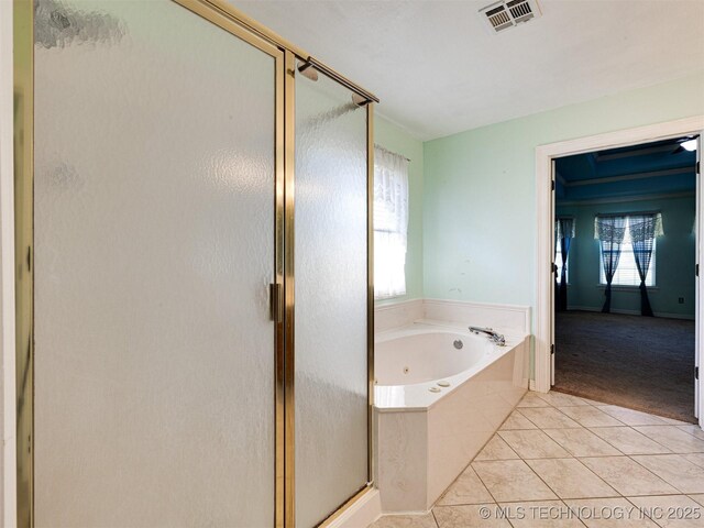 8704 N 140th E Ct, Owasso, OK 74055 - bathroom with a stall shower, a whirlpool tub, and tile patterned flooring