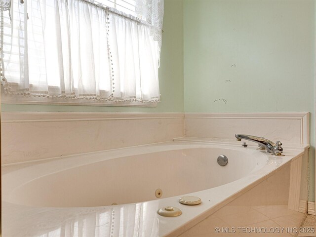 8704 N 140th E Ct, Owasso, OK 74055 - bathroom with a tub with jets