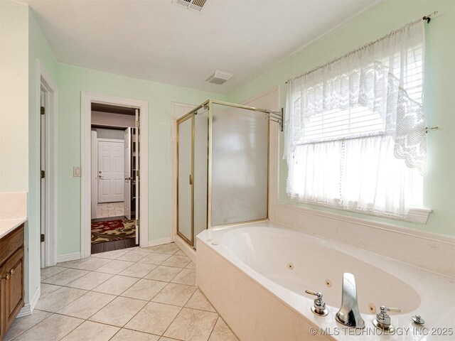 8704 N 140th E Ct, Owasso, OK 74055 - bathroom featuring vanity, a stall shower, a tub with jets, and tile patterned floors