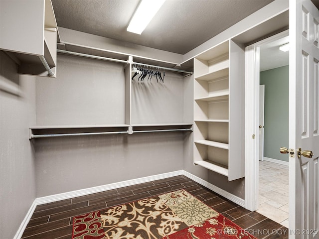 8704 N 140th E Ct, Owasso, OK 74055 - walk in closet featuring wood tiled floors
