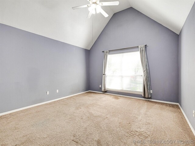 8704 N 140th E Ct, Owasso, OK 74055 - carpeted spare room featuring vaulted ceiling, a ceiling fan, and baseboards