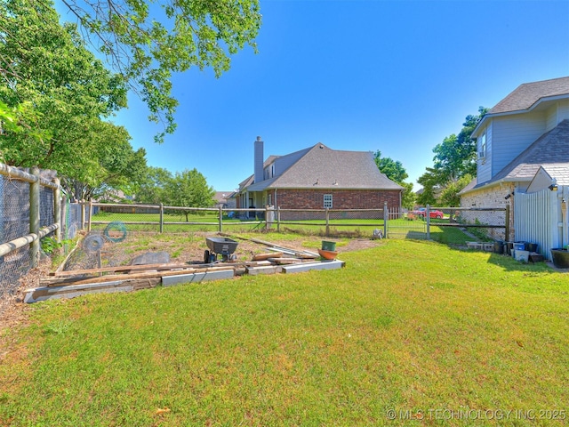 8704 N 140th E Ct, Owasso, OK 74055 - view of yard with a vegetable garden