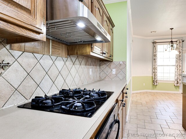 8704 N 140th E Ct, Owasso, OK 74055 - kitchen with wall chimney range hood, black gas cooktop, light countertops, crown molding, and baseboards
