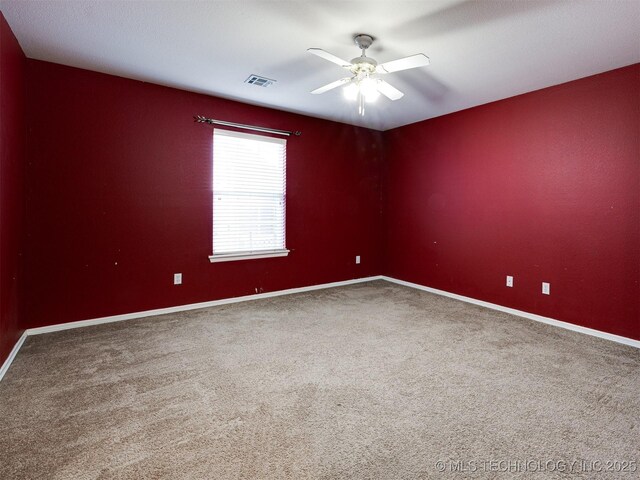 8704 N 140th E Ct, Owasso, OK 74055 - unfurnished room featuring a ceiling fan, carpet, and baseboards