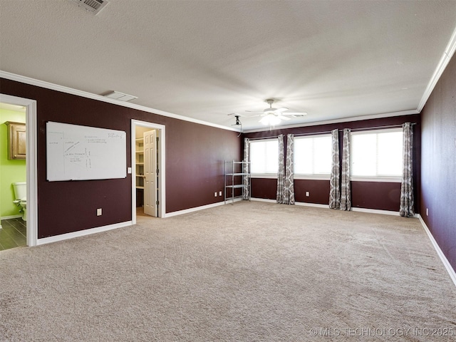 8704 N 140th E Ct, Owasso, OK 74055 - empty room with crown molding, carpet, a textured ceiling, baseboards, and ceiling fan