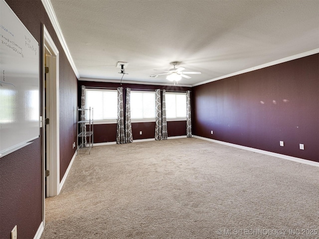 8704 N 140th E Ct, Owasso, OK 74055 - carpeted empty room featuring ornamental molding, ceiling fan, baseboards, plenty of natural light, and a textured ceiling