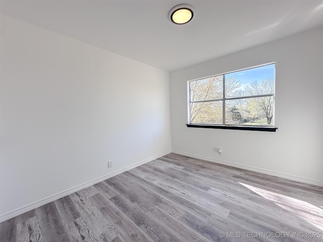 2212 W Independence Pl, Tulsa, OK 74127 - empty room featuring wood finished floors and baseboards