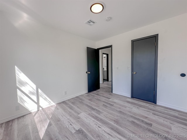 2212 W Independence Pl, Tulsa, OK 74127 - unfurnished bedroom with light wood finished floors and baseboards