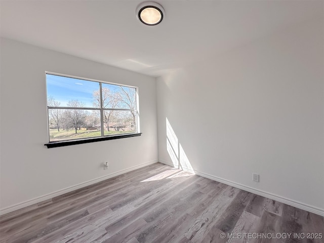 2212 W Independence Pl, Tulsa, OK 74127 - spare room with wood finished floors and baseboards