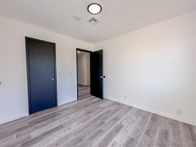 2212 W Independence Pl, Tulsa, OK 74127 - unfurnished bedroom with light wood finished floors and baseboards