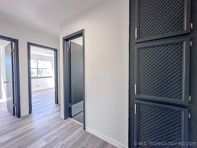 2212 W Independence Pl, Tulsa, OK 74127 - hallway with baseboards and light wood-type flooring