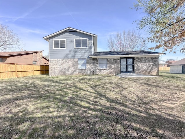 2212 W Independence Pl, Tulsa, OK 74127 - rear view of house with brick siding
