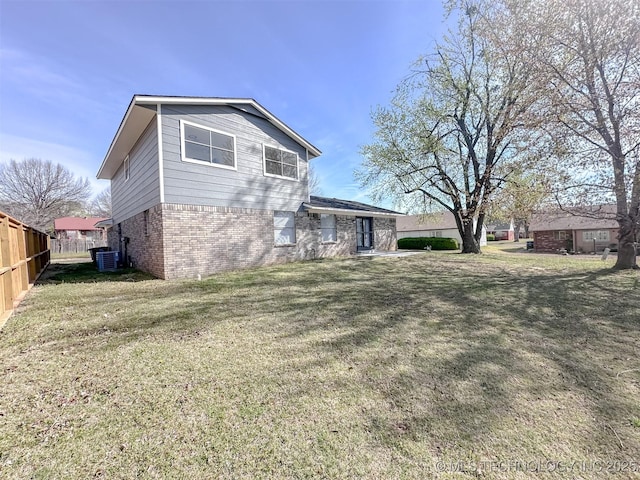 2212 W Independence Pl, Tulsa, OK 74127 - view of side of property featuring brick siding and central AC unit