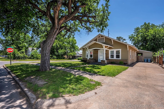 423 E Cherry St, Cushing, OK 74023 - view of front of home featuring driveway and stone siding