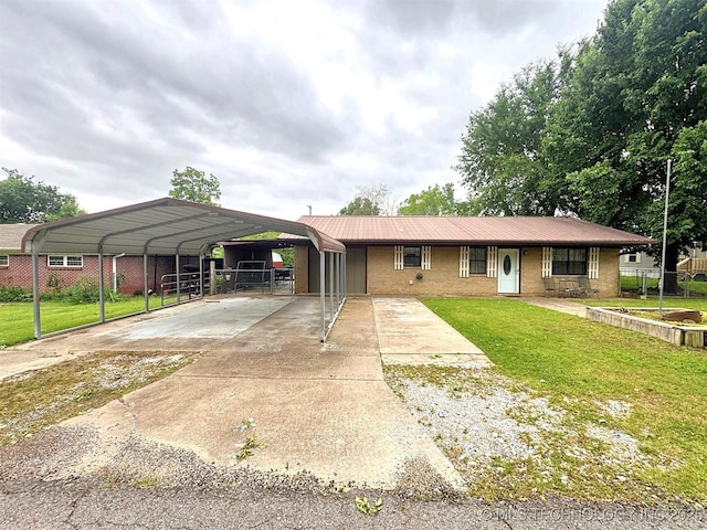 510 Beverly Ave, Vian, OK 74962 - view of front of property featuring a detached carport, concrete driveway, and brick siding