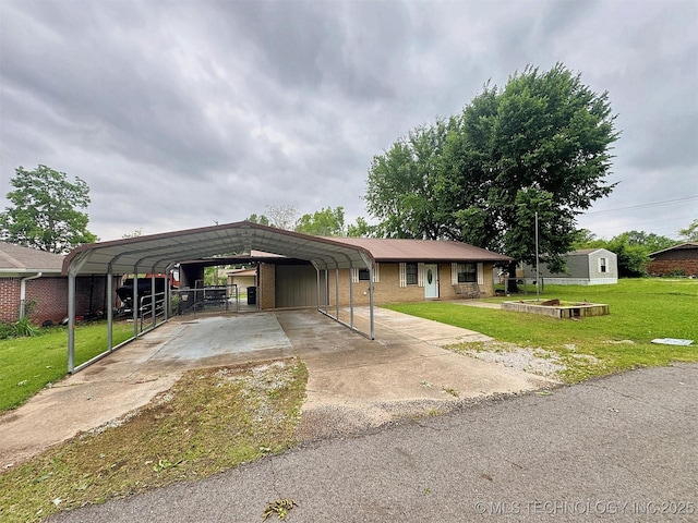 510 Beverly Ave, Vian, OK 74962 - single story home featuring a carport, a front yard, concrete driveway, and an outdoor structure