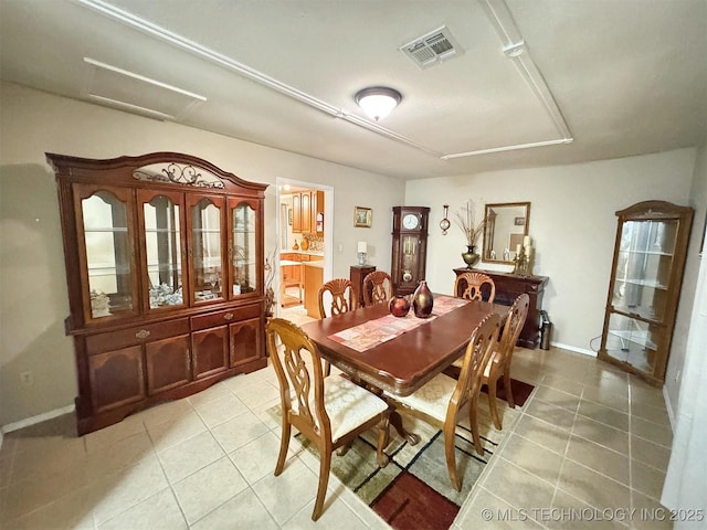 510 Beverly Ave, Vian, OK 74962 - dining room with light tile patterned flooring, baseboards, and attic access