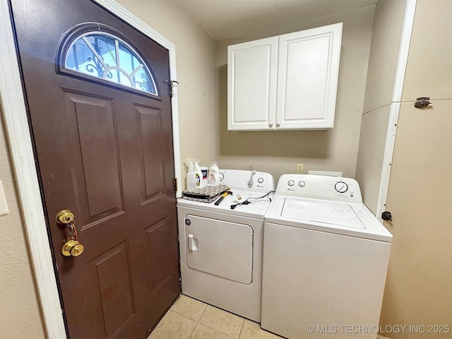 510 Beverly Ave, Vian, OK 74962 - washroom with washing machine and dryer, cabinet space, and light tile patterned floors