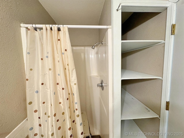 510 Beverly Ave, Vian, OK 74962 - full bathroom featuring a textured wall and a shower with curtain