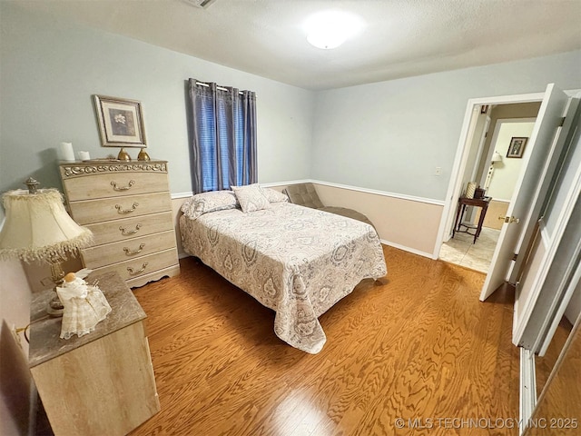 510 Beverly Ave, Vian, OK 74962 - bedroom featuring wood finished floors and baseboards
