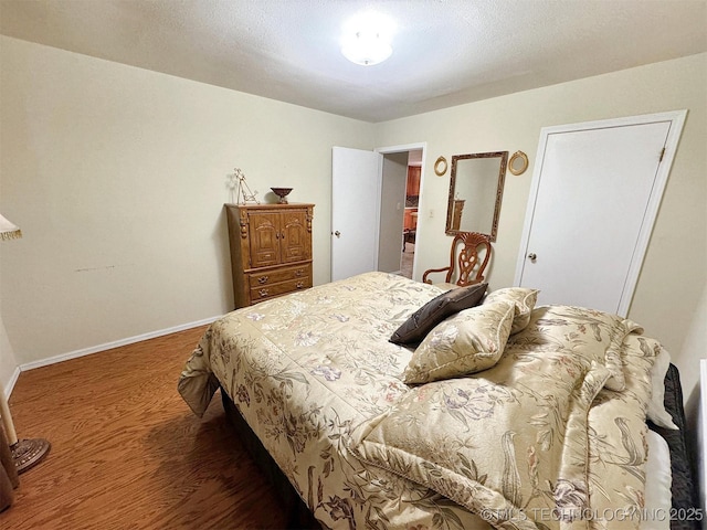 510 Beverly Ave, Vian, OK 74962 - bedroom with wood finished floors and baseboards