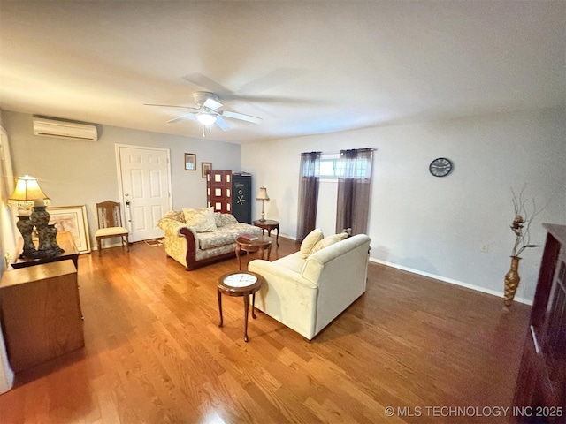 510 Beverly Ave, Vian, OK 74962 - living area featuring a wall mounted AC, wood finished floors, a ceiling fan, and baseboards