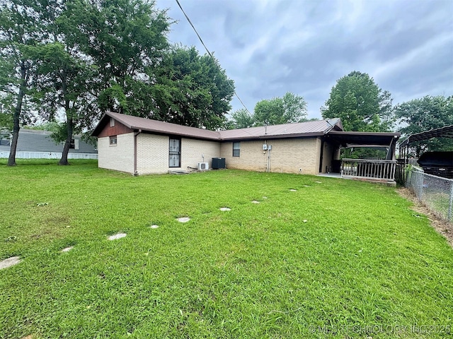 510 Beverly Ave, Vian, OK 74962 - back of property featuring metal roof, a carport, central AC, and brick siding