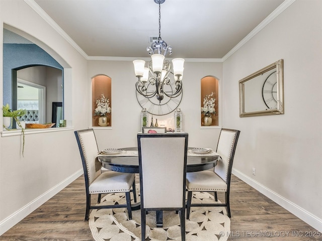 2008 N 8th St, Broken Arrow, OK 74012 - dining area with wood finished floors, a chandelier, baseboards, ornamental molding, and arched walkways