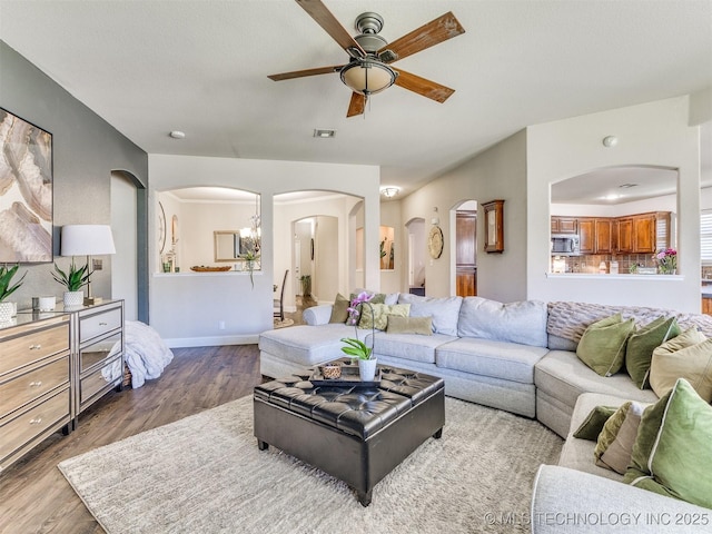 2008 N 8th St, Broken Arrow, OK 74012 - living area with a ceiling fan, wood finished floors, arched walkways, and baseboards