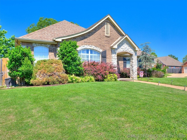 2008 N 8th St, Broken Arrow, OK 74012 - view of front of property featuring a front lawn, brick siding, and a shingled roof