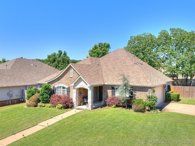 2008 N 8th St, Broken Arrow, OK 74012 - view of front facade featuring brick siding, a garage, concrete driveway, and roof with shingles