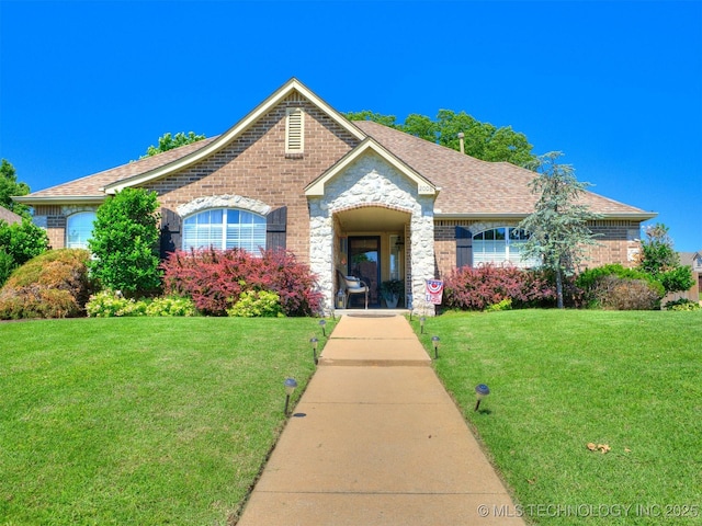 2008 N 8th St, Broken Arrow, OK 74012 - view of front of house with a front lawn, brick siding, and roof with shingles