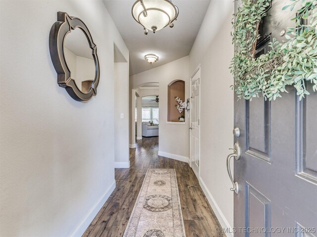 2008 N 8th St, Broken Arrow, OK 74012 - entryway with arched walkways, dark wood-style floors, and baseboards