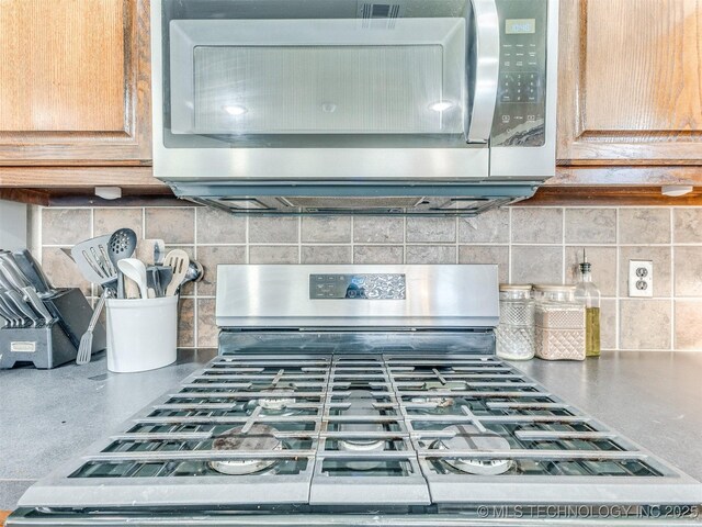 2008 N 8th St, Broken Arrow, OK 74012 - kitchen view of appliances with stainless steel finishes and decorative backsplash