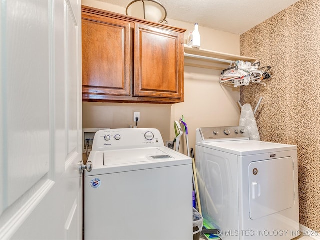 2008 N 8th St, Broken Arrow, OK 74012 - laundry area with washing machine and clothes dryer and cabinet space