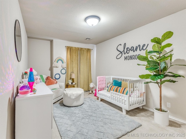 2008 N 8th St, Broken Arrow, OK 74012 - carpeted bedroom featuring a textured ceiling and baseboards