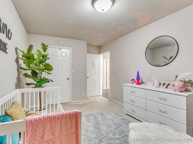 2008 N 8th St, Broken Arrow, OK 74012 - bedroom with light colored carpet, baseboards, and a textured ceiling