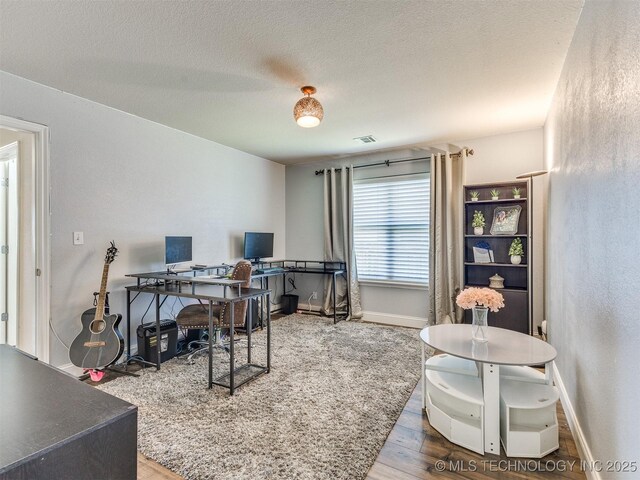 2008 N 8th St, Broken Arrow, OK 74012 - office space featuring wood finished floors, baseboards, and a textured ceiling
