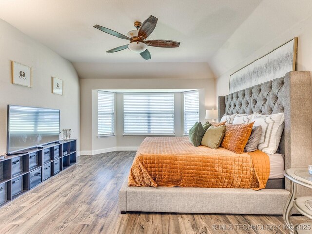 2008 N 8th St, Broken Arrow, OK 74012 - bedroom with vaulted ceiling, wood finished floors, a ceiling fan, and baseboards