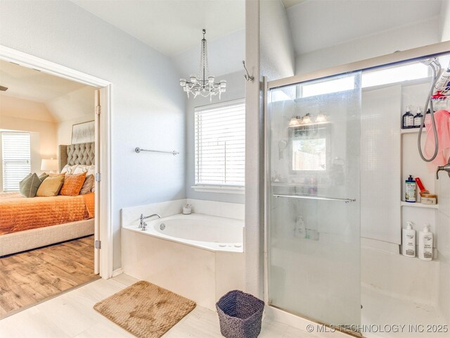 2008 N 8th St, Broken Arrow, OK 74012 - full bath featuring ensuite bath, a stall shower, a bath, a chandelier, and vaulted ceiling